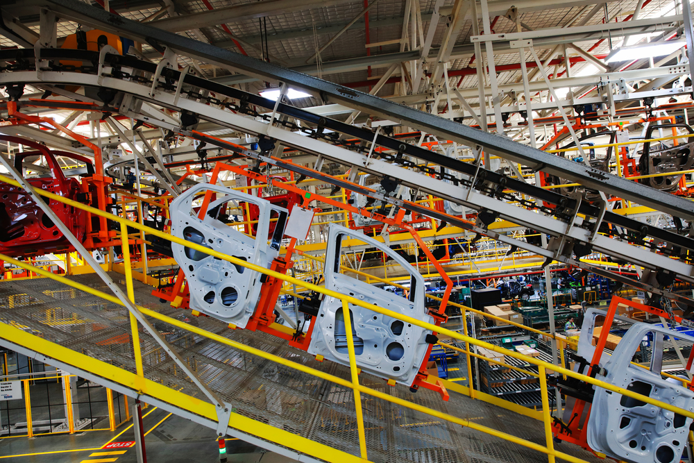 Car doors on assembly line in automotive manufacturing plant